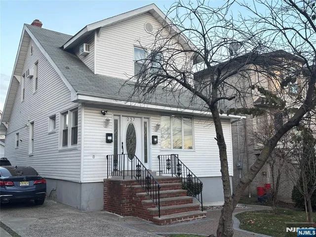 a view of a house with a tree
