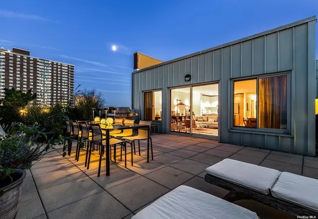 a view of a hallway with stairs and wooden floor
