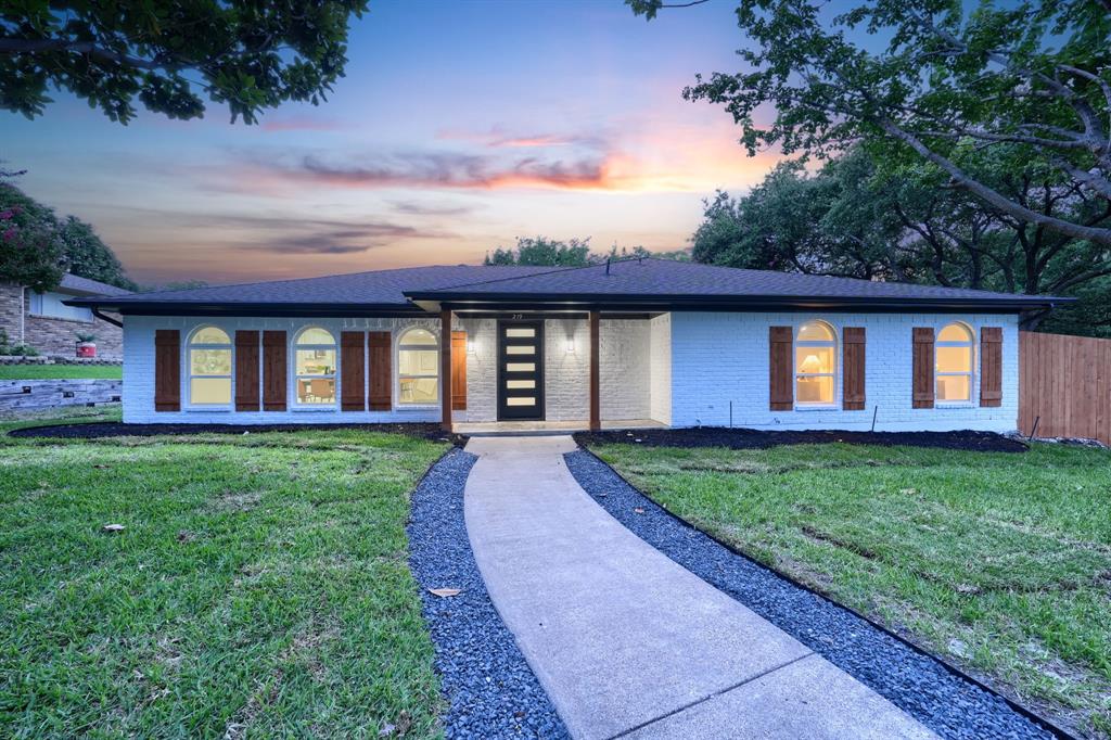 front view of a house with a yard
