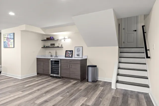 a view of a kitchen with refrigerator and cabinets