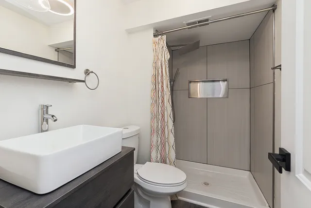 a view of a yard with flower plants