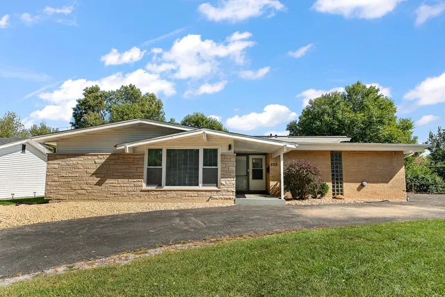 front view of a house with a yard