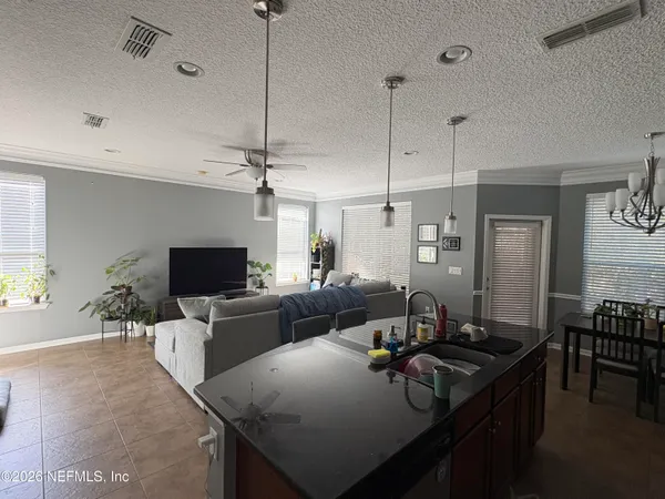 a living room with furniture and a flat screen tv