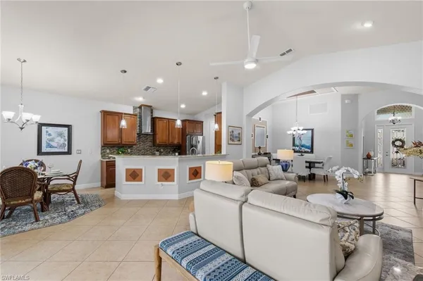a living room with furniture and flat screen tv