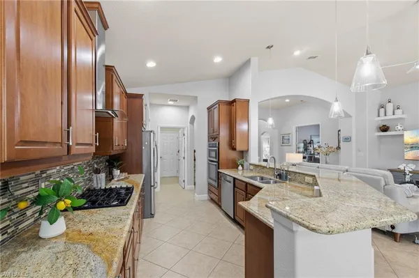 a kitchen with a refrigerator and a sink