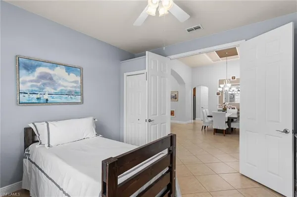 a room with a bed and furniture