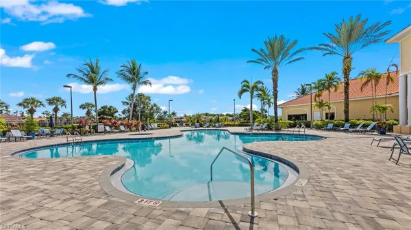 a view of a swimming pool with a patio