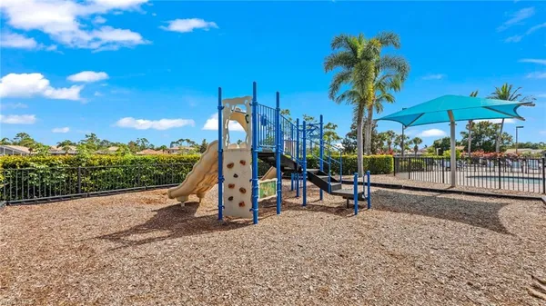 a view of a park with swings and slides