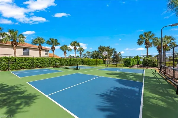 a view of a playground and basketball court