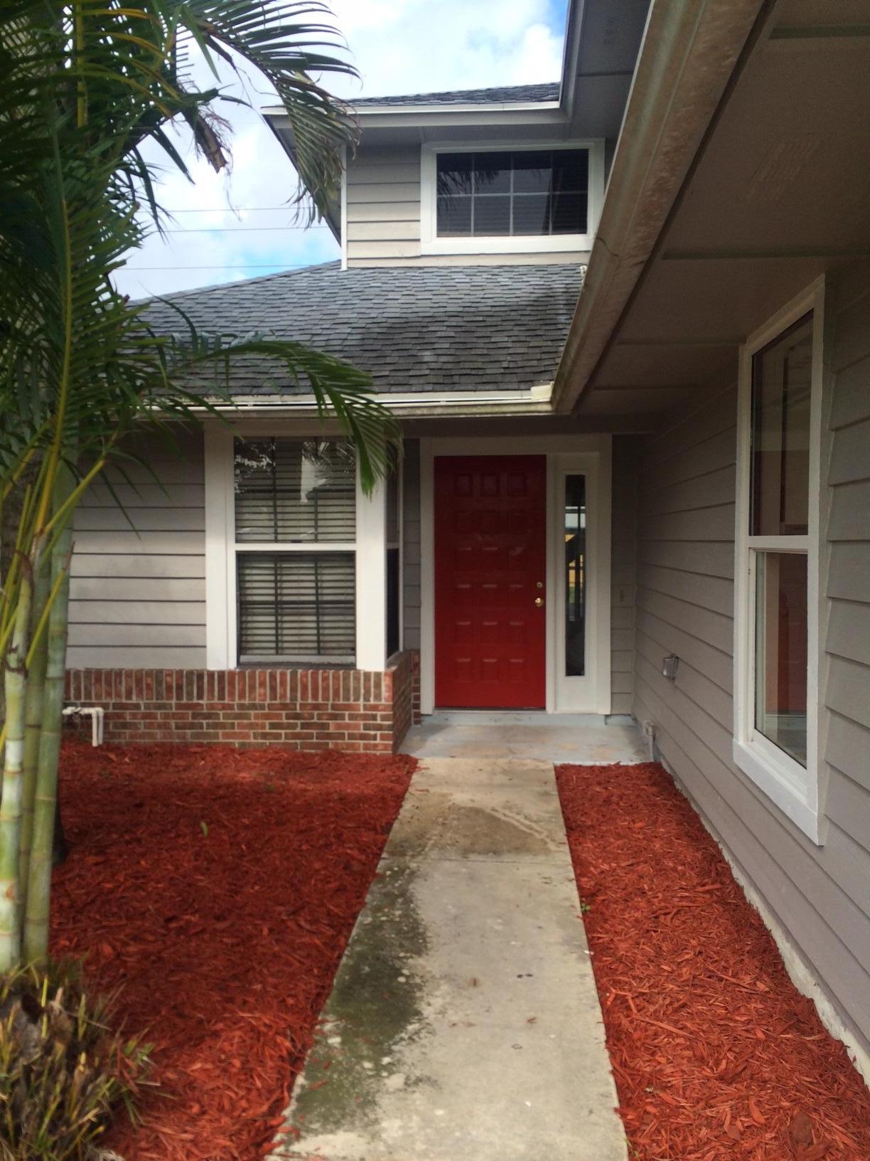 6667 Southeast Raintree Avenue Stuart, FL 34997 - Photo 3 of 22 FRONT 2