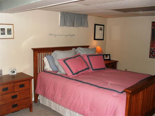 202 Shawmut Street Springfield, MA 01108 - Photo 19 of 30 a bedroom with a bed and a dresser