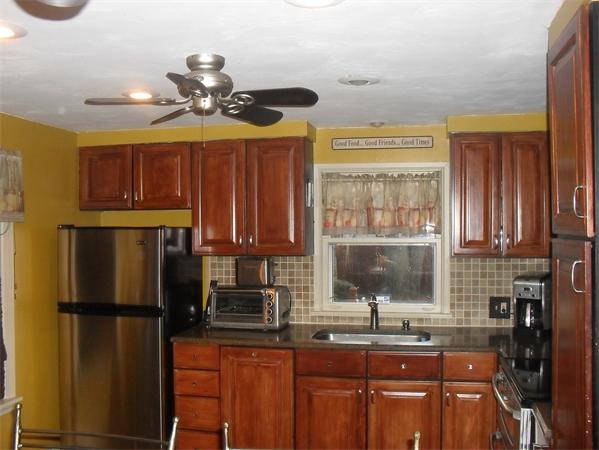 202 Shawmut Street Springfield, MA 01108 - Photo 4 of 30 a kitchen with a refrigerator and a sink