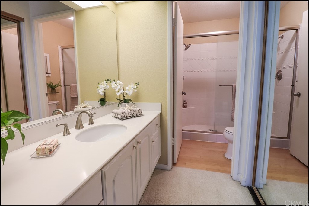 16 Pineoak Aliso Viejo, CA 92656 - Photo 12 of 24 a bathroom with a sink a toilet and shower