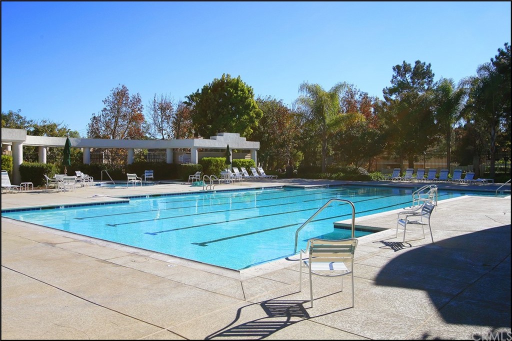 16 Pineoak Aliso Viejo, CA 92656 - Photo 20 of 24 a view of swimming pool with seating area and trees in the background