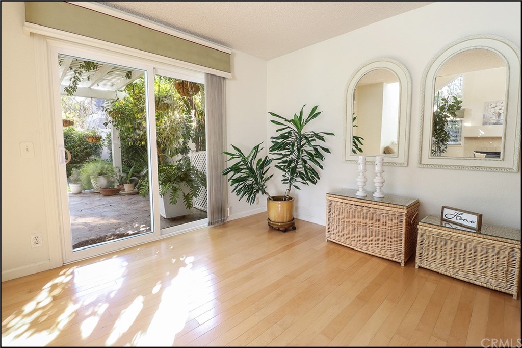 16 Pineoak Aliso Viejo, CA 92656 - Photo 4 of 24 a view of a room with wooden floor and windows