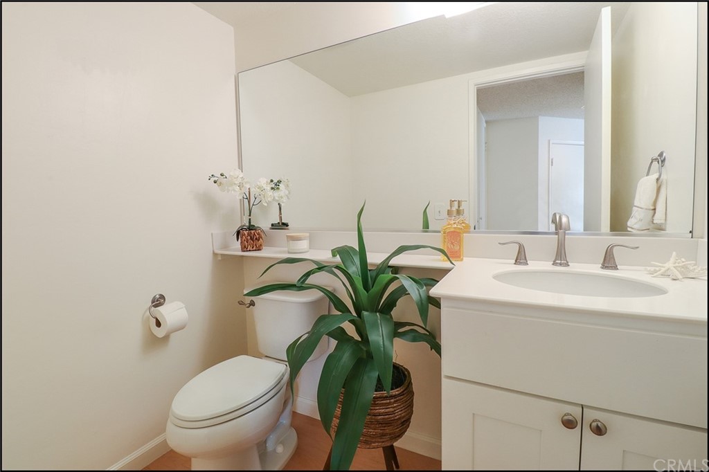16 Pineoak Aliso Viejo, CA 92656 - Photo 9 of 24 a bathroom with a toilet sink and mirror