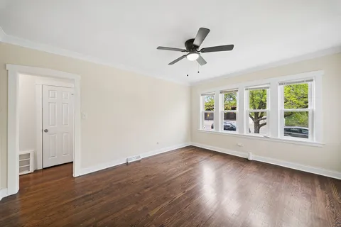 a view of room window and wooden floor