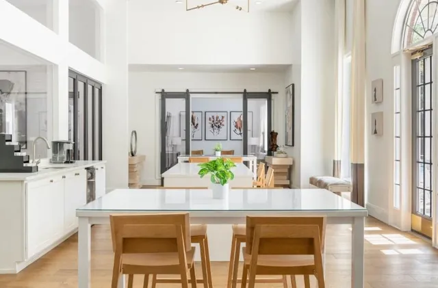 a kitchen with a table and chairs in it