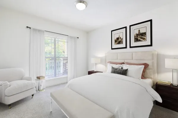 a bedroom with a bed and a couch