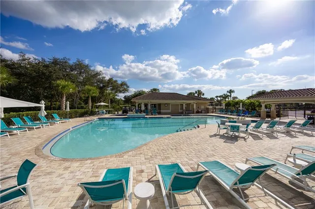 an outdoor space with furniture and city view