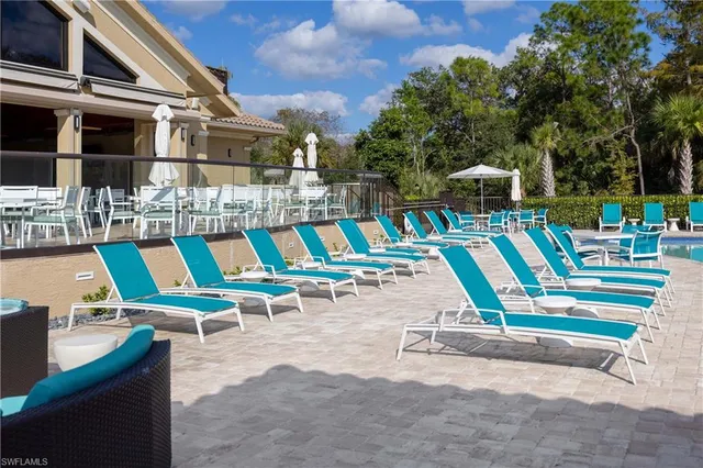 a view of a swimming pool with a lounge chair