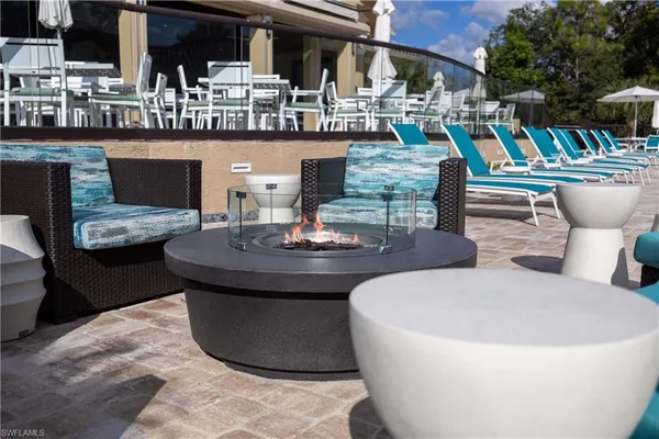 a kitchen with a table and chairs