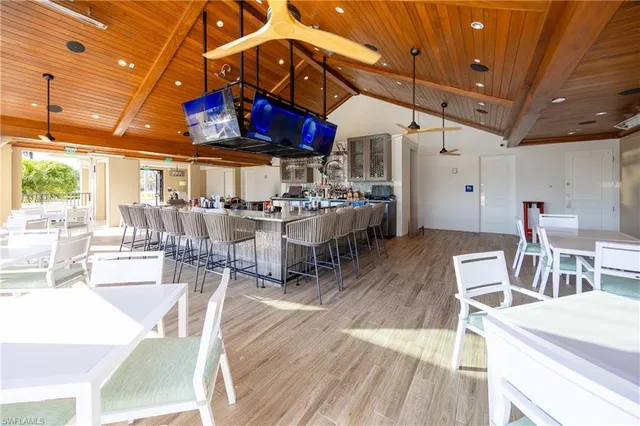 a view of a dining hall with many windows