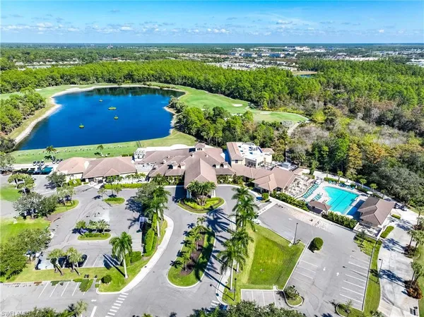 an aerial view of house with yard swimming pool and outdoor seating