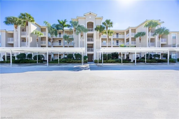 a front view of building with yard