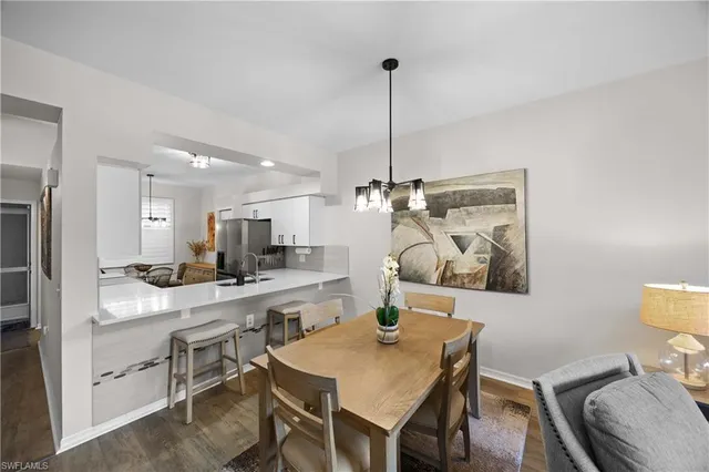 a view of a dining room and a table and chairs