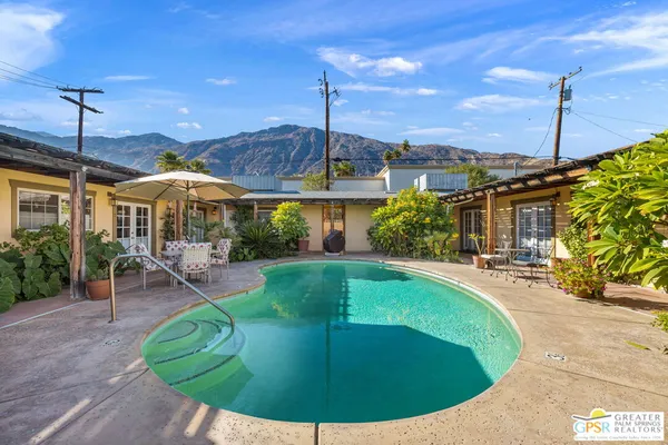 a view of a house with swimming pool