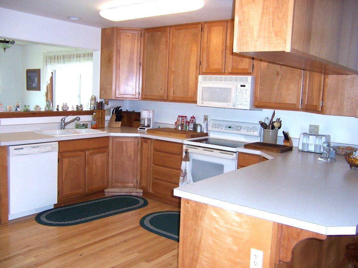 501 Sharp Road Tieton, WA 98947 - Photo 3 of 13 a kitchen with a sink stove and cabinets