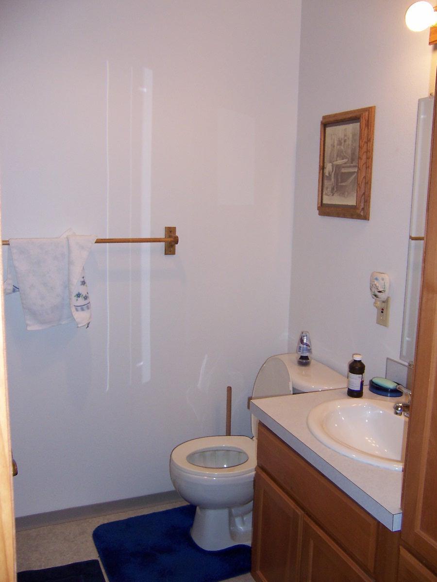 501 Sharp Road Tieton, WA 98947 - Photo 9 of 13 a bathroom with a sink a toilet and a mirror