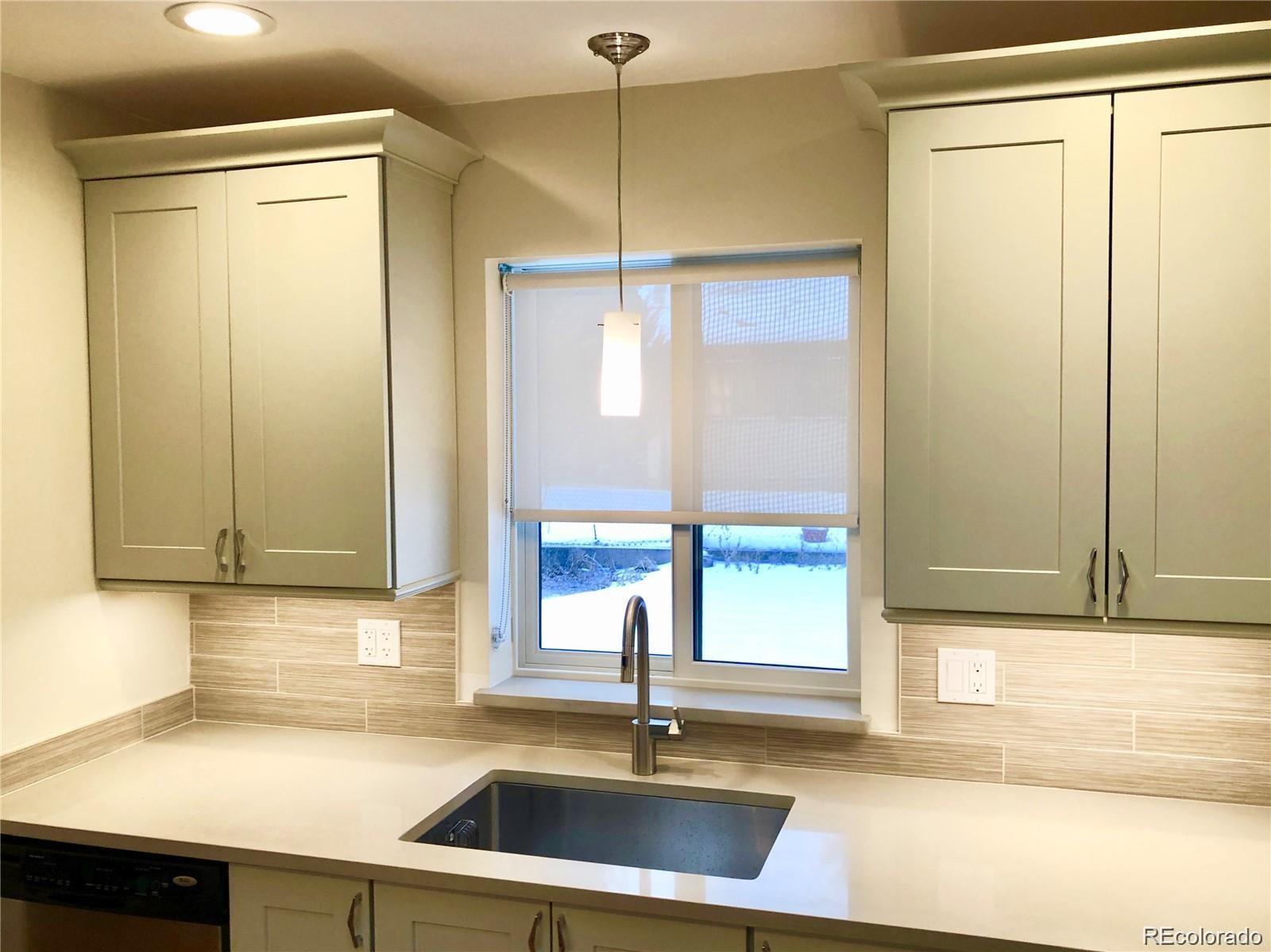 3022 South Gilpin Street Denver, CO 80210 - Photo 11 of 28 a kitchen with a sink and a window