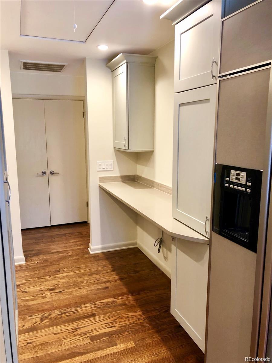 3022 South Gilpin Street Denver, CO 80210 - Photo 16 of 28 a kitchen with granite countertop a refrigerator and a sink