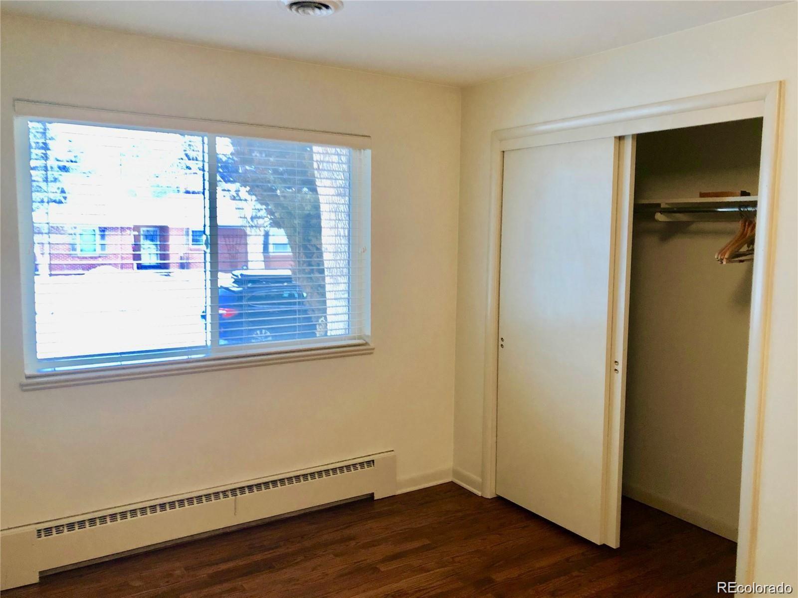 3022 South Gilpin Street Denver, CO 80210 - Photo 22 of 28 a view of empty room with wooden floor and fan