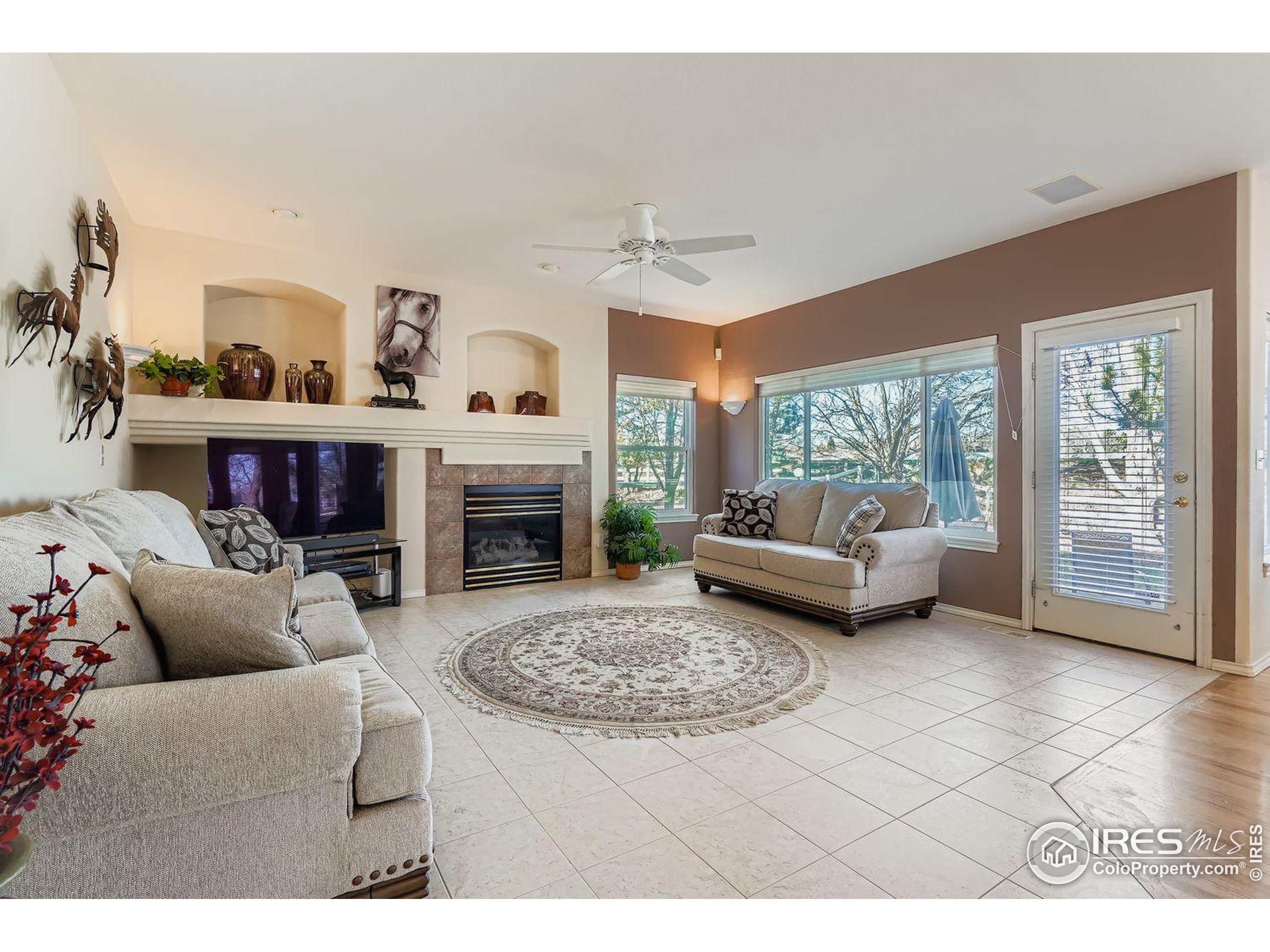 569 Flying Jib Court Lafayette, CO 80026 - Photo 14 of 31 a living room with furniture and a fireplace