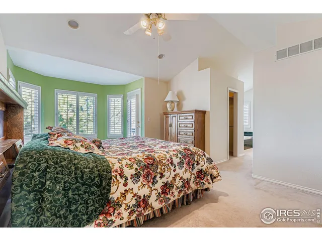 a spacious bathroom with a granite countertop tub sink and mirror