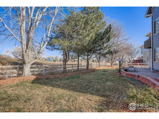 a wooden bench sitting in front of a building