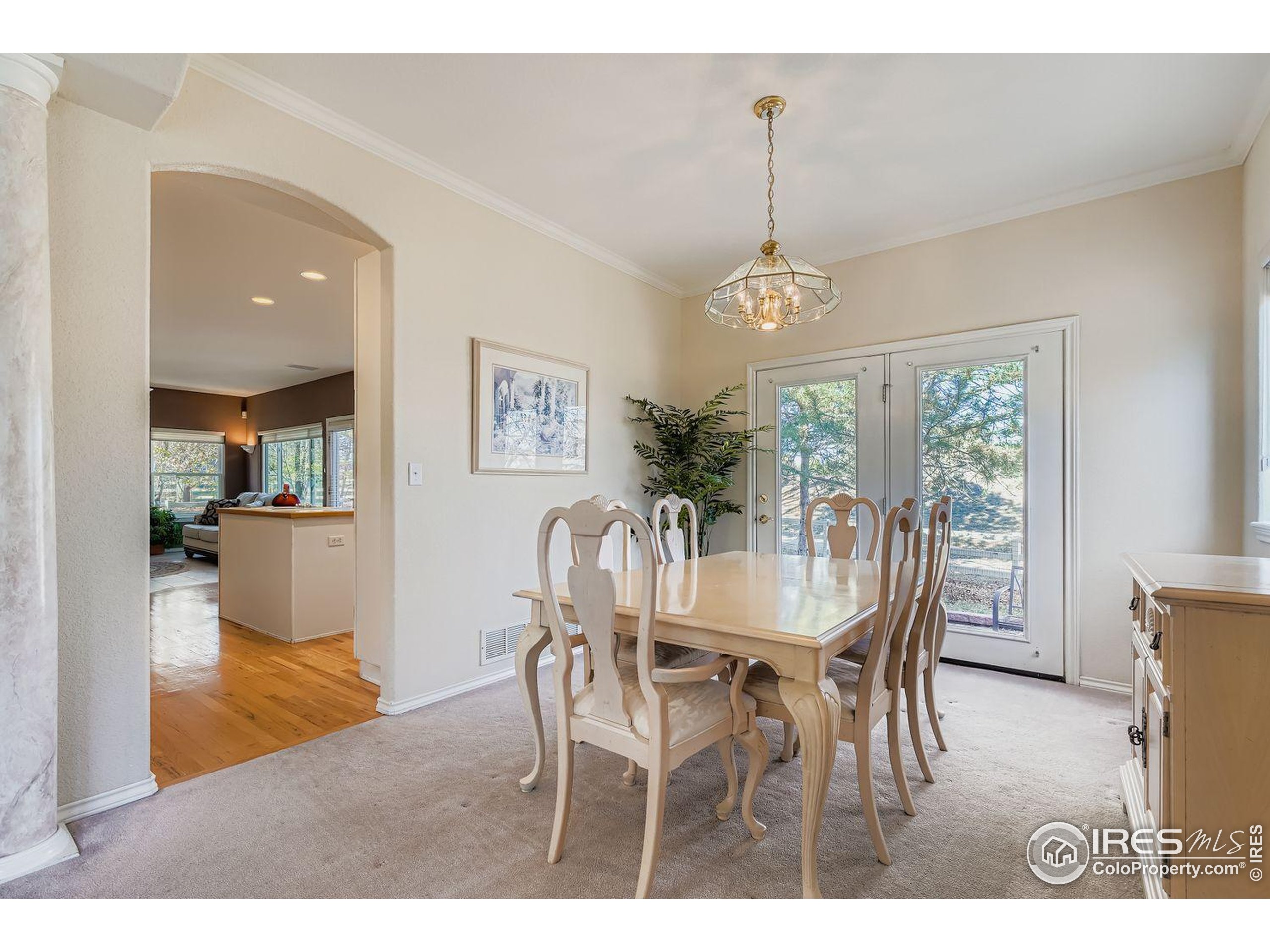 569 Flying Jib Court Lafayette, CO 80026 - Photo 8 of 31 a dining room with furniture window wooden floor