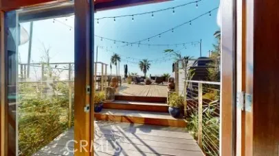 a view of balcony and deck with patio