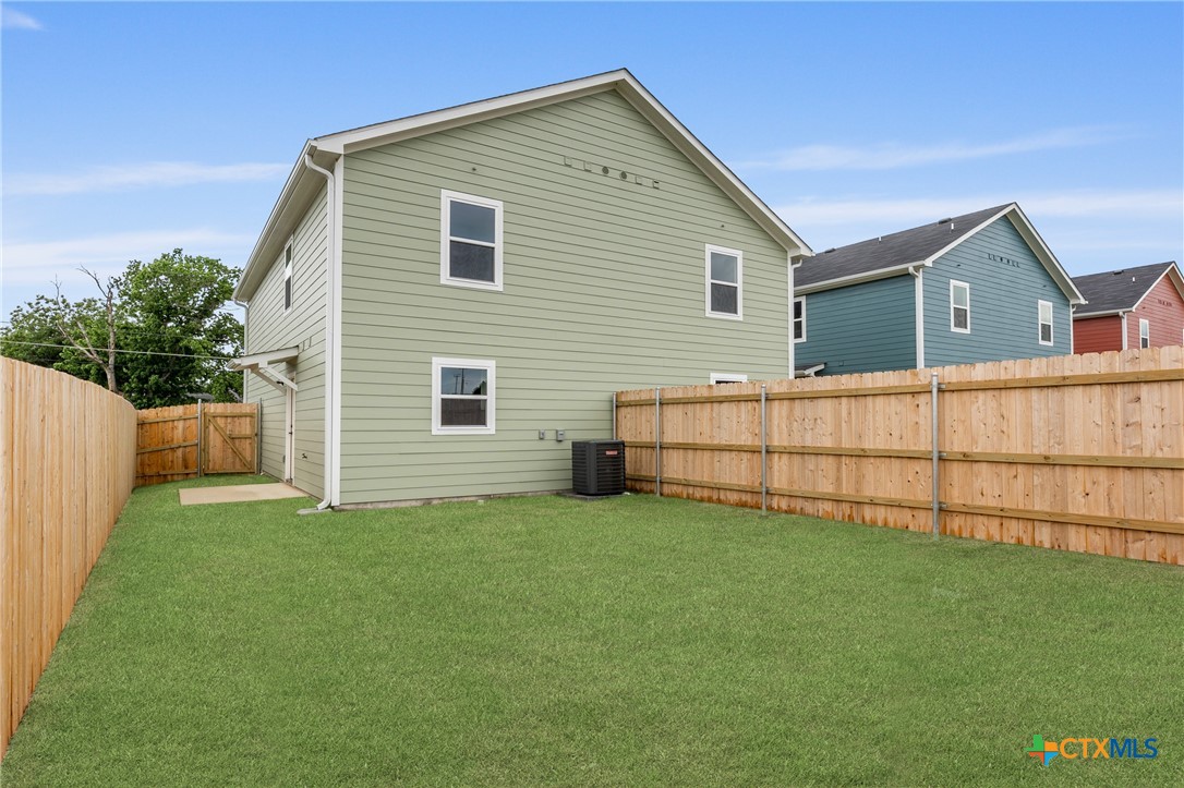 1015 South 26th Street, Unit B Temple, TX 76501 - Photo 22 of 22 a view of backyard with small cabin and wooden fence