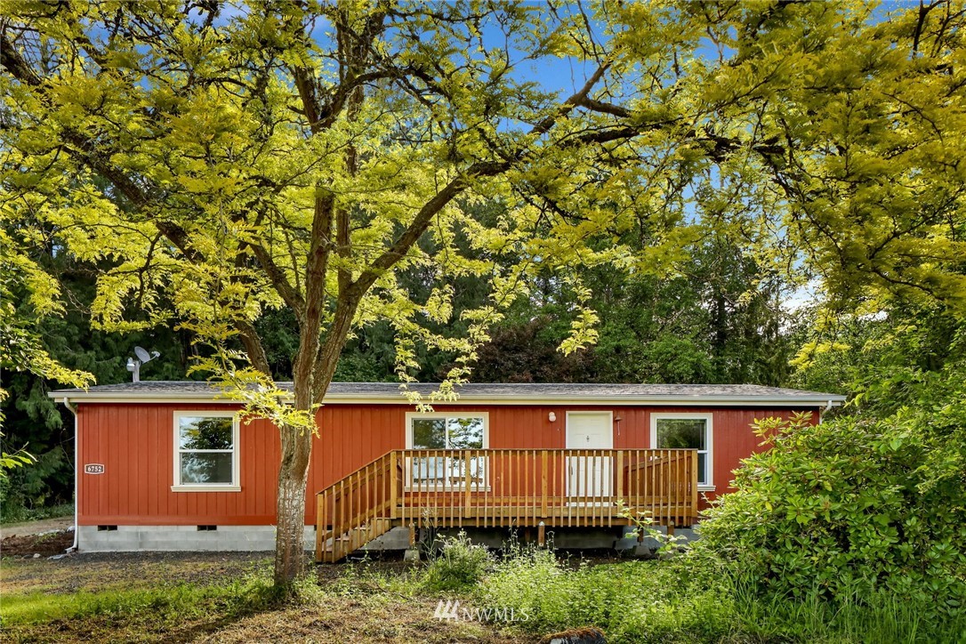 6752 Goodwin Road Everson, WA 98247 - Photo 2 of 28 a view of backyard with large tree and wooden fence