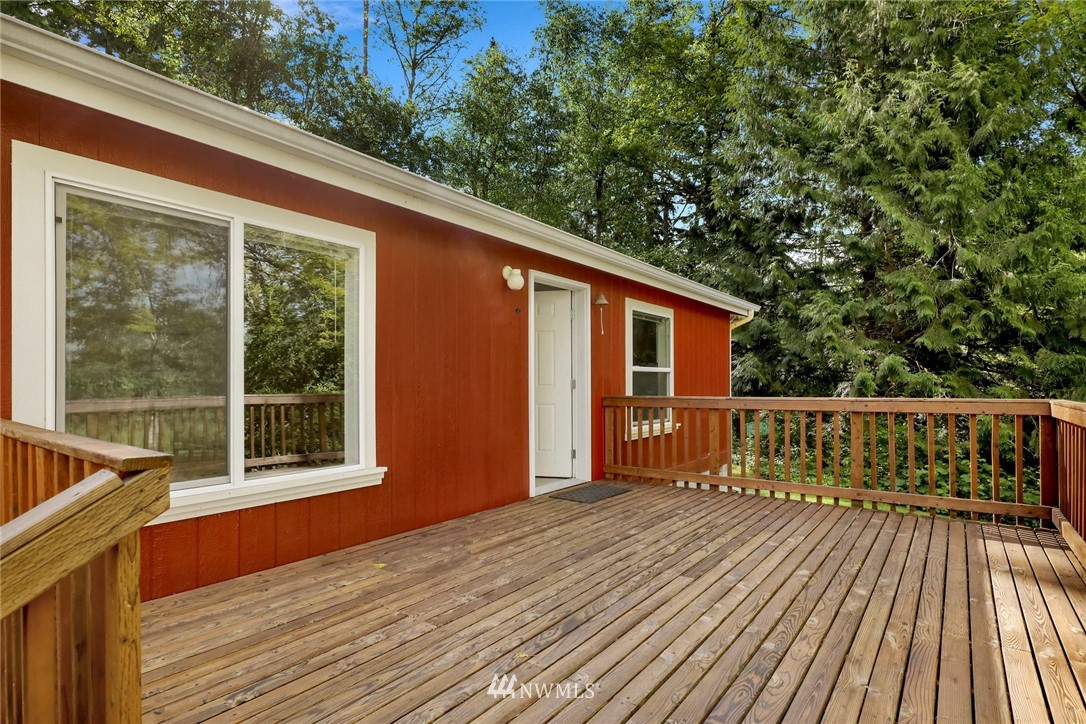 6752 Goodwin Road Everson, WA 98247 - Photo 3 of 28 a balcony with wooden floor and brick walls
