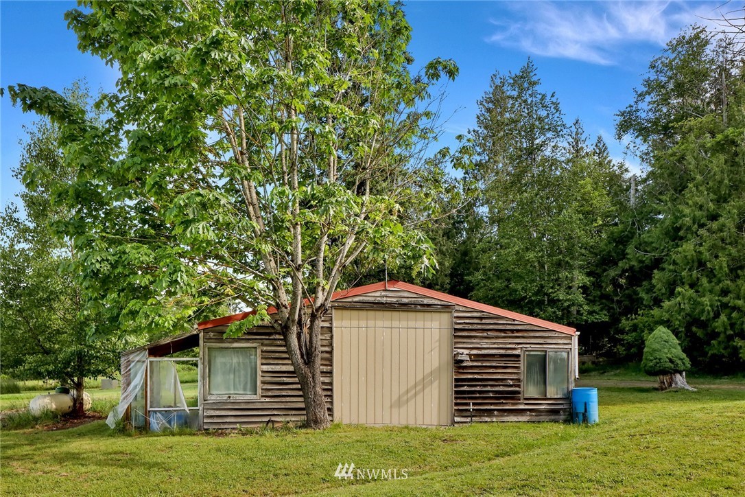 6752 Goodwin Road Everson, WA 98247 - Photo 6 of 28 a front view of a house with a garden