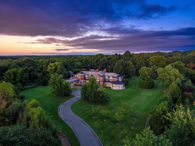 a view of a swimming pool with a yard
