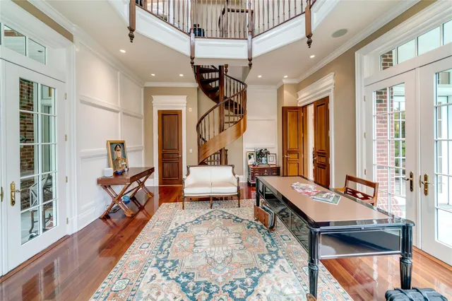 a view of a swimming pool with lawn chairs and a fire pit