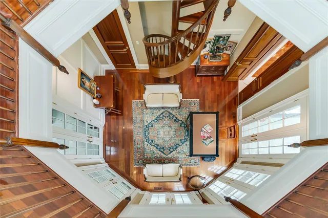 an aerial view of a house with garden space and lake view