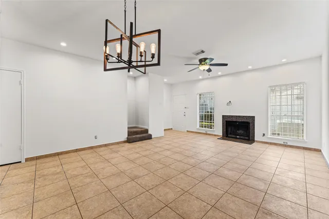 a view of an empty room with a fireplace