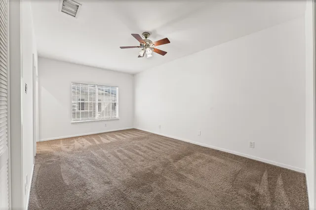 a view of empty room with windows